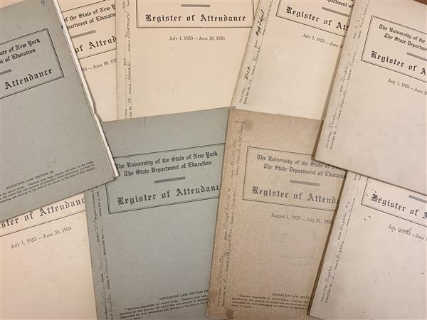 An array of old school registers showing the covers