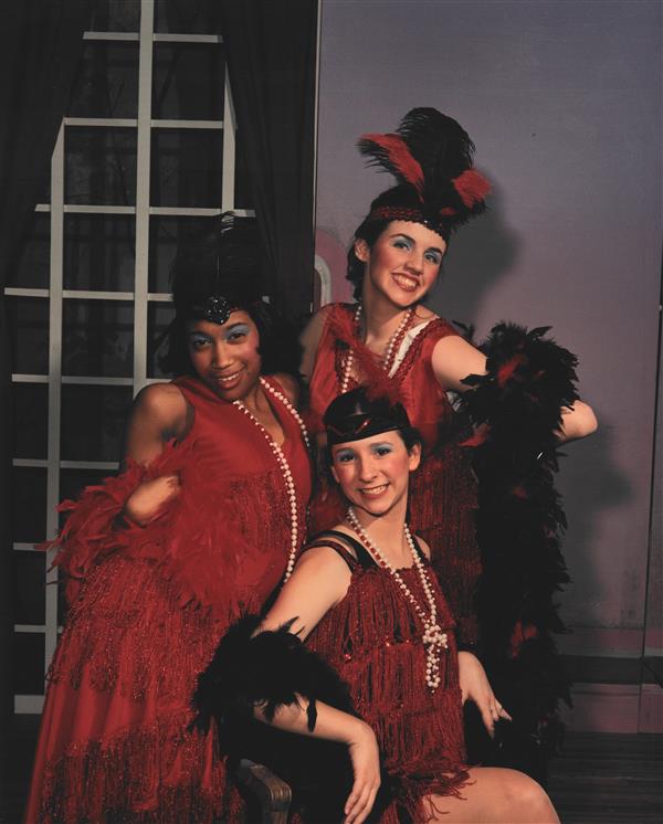 Three girls in red costumes posed for the photo